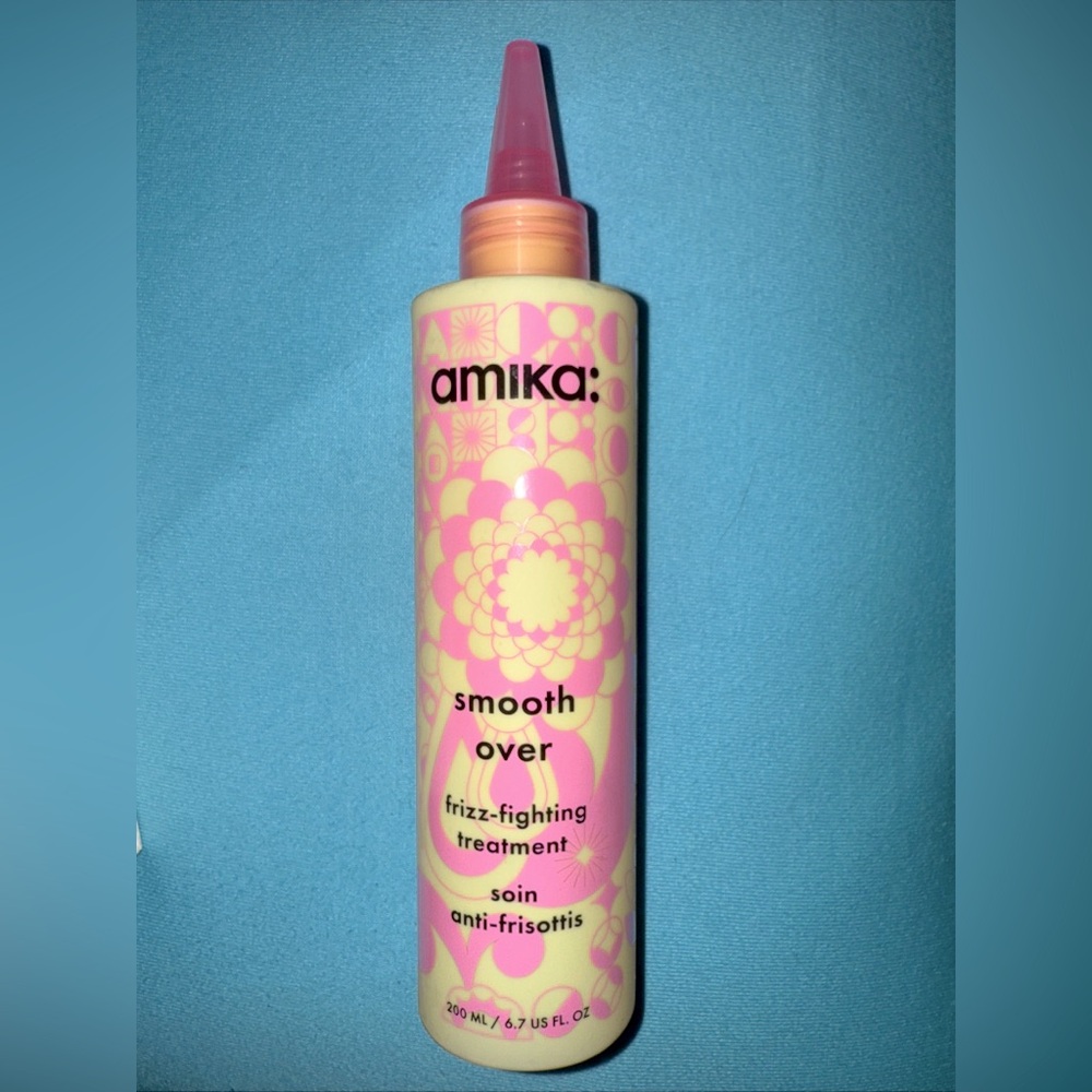 Amika Smooth Over Frizz-Fighting Treatment in Pink and Cream